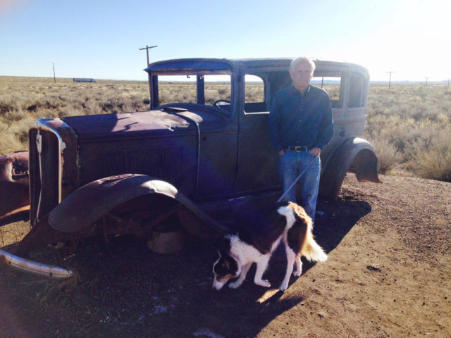 Me with Haylie, my dog, in front of an old Studebaker